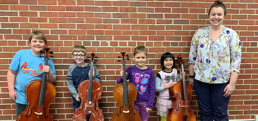 Suzuki cello students Clayton Leuchtenberg, Gentry Jones, Julia Lewis and Esther Wai with cello instructor Kayla Schoeny