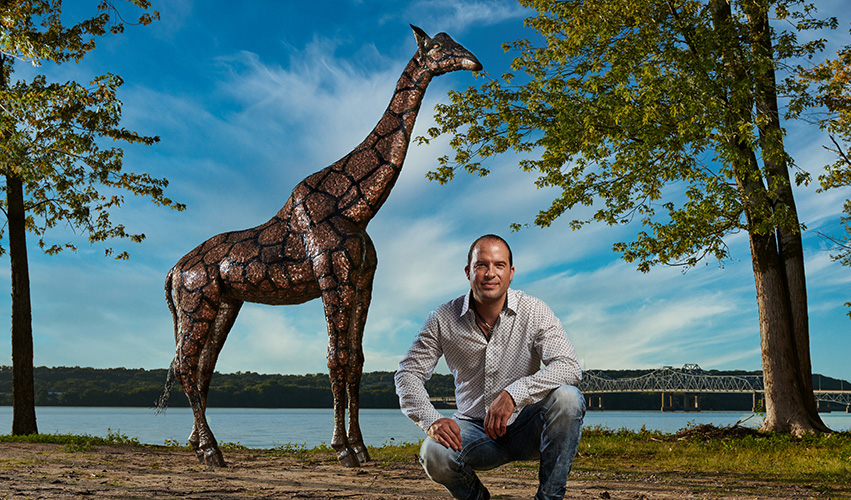 Among de Gallo's latest work, this 14-foot-tall, 600-pound giraffe sculpture is covered from head to toe in U.S. pennies and took over 800 hours to complete. Photo by Jeffery Noble