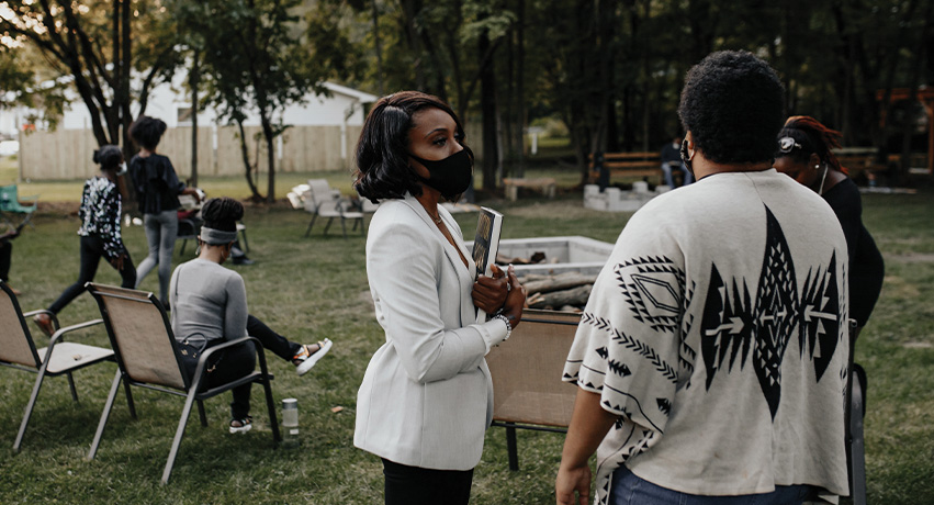 St. Louis speaks to attendees at a meet-and-greet event at Legacy Park on the south end of Peoria.