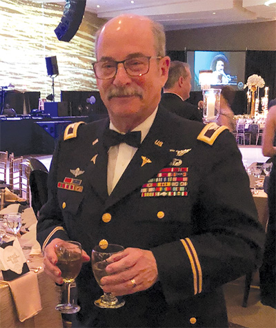 Dr Rick Pearl in Dress uniform at an event