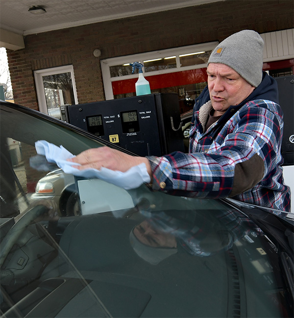 Don Gibson cleaning a customer’s window