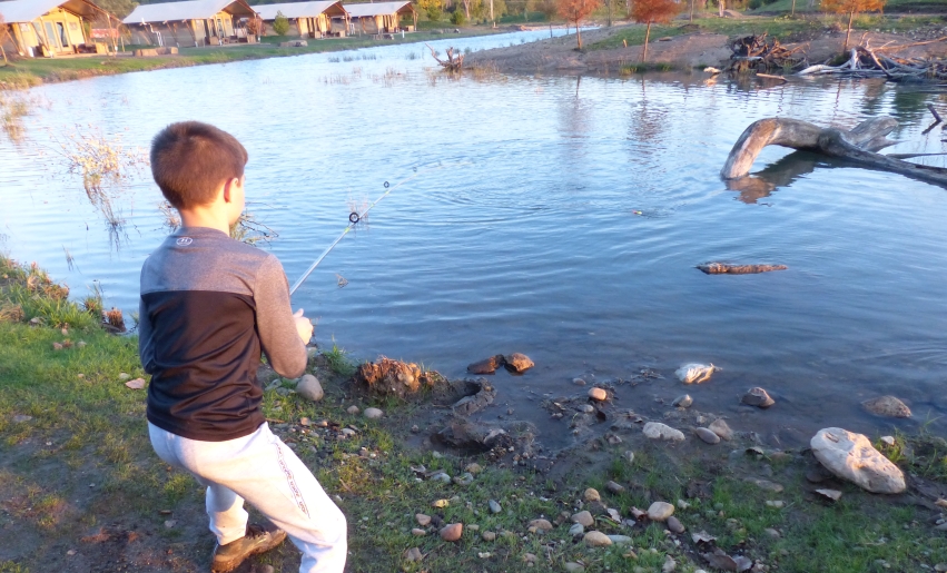 Carter, age eight, with a freshly caught trout at Sankoty Lakes.