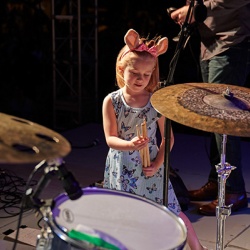 Young Girl on stage with Drums sticks 