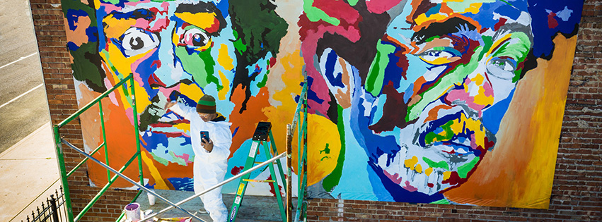 Peoria artist Andre Petty at work on a mural at the 2019 Big Picture Street Festival