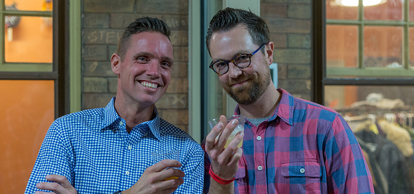 Adults enjoying drinks at a fundraiser