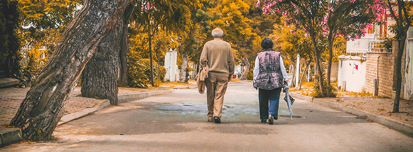 Elderly couple walking together