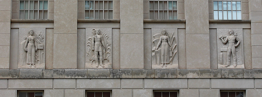 The Federal Building is decorated with four art-deco limestone bas-reliefs, carved onsite during a January blizzard by Chicago artist Freeman L. Schoolcraft.  L-R: “Peoria Postal Worker,” “Potawatomi Native American,” “Woman of Peoria Agriculture” and “Man of Peoria Industry.”