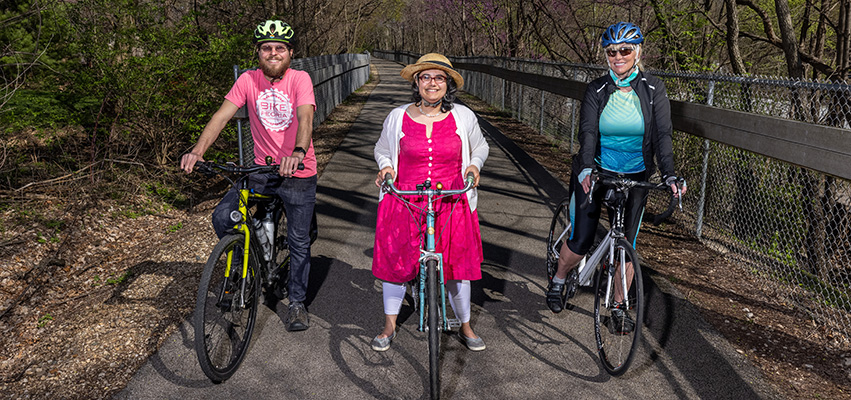 Kathy Jones, Evan Stumpges and Michelle Perkinson on the Rock Island Greenway behind Trefzger’s Bakery, April 12, 2021. Photograph by Jeffery Noble