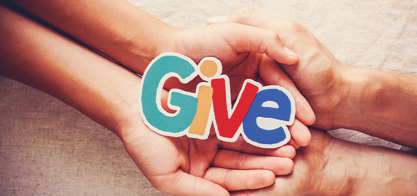 Hands with the word "Give"