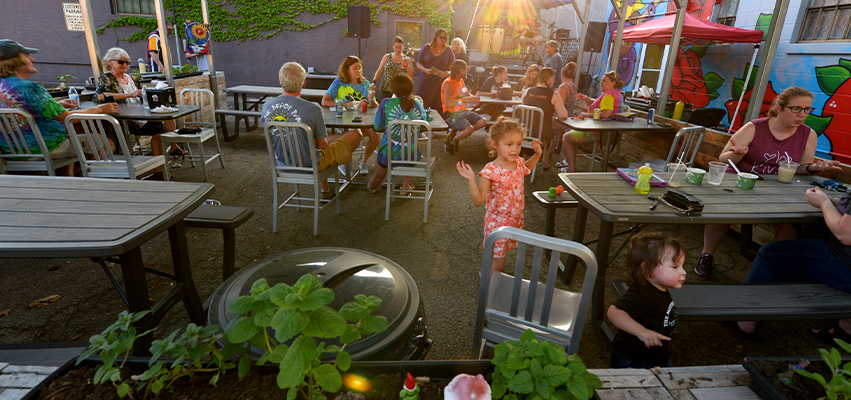 Customers dining on the patio at West Peoria’s Touch of Grey
