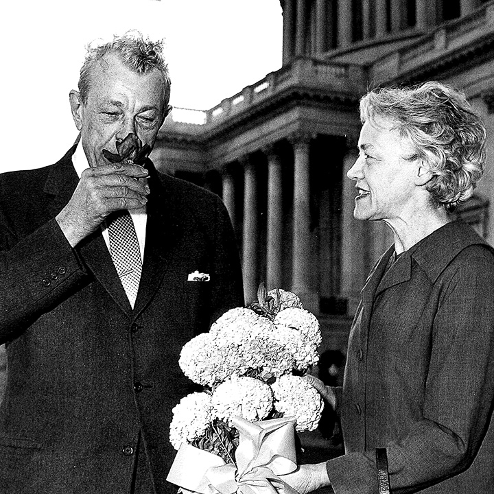 Dirksen and Smith with a bouquet of marigolds on Capitol Hill, 1964.