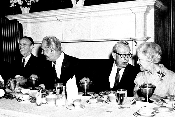 Senators Everett Dirksen and Smith exchange conversation at a luncheon for President Lyndon Johnson, late 1960s.