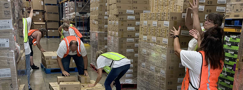 Volunteers help pack supplies