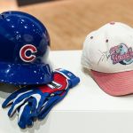 Ben Zobrist’s batting helmet and gloves worn during his famous Game 7 10th-inning hit that led to a Cubs victory in the 2016 World Series, alongside a 1995 World Series championship hat signed by Peoria native Jim Thome