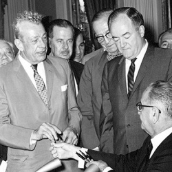 At the signing ceremony for the Civil Rights Act of 1964, President Lyndon Johnson hands one of the pens he used to Senator Everett Dirksen.