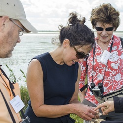 TNC State Director Michelle Carr inspects mussels discovered by TNC Aquatic Biologist Maria Lemke at Emiquon National Wildlife Refuge