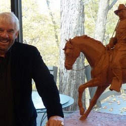 Lonnie Stewart and his preliminary model of President Theodore Roosevelt