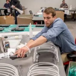 ATS employee working on producing face shields