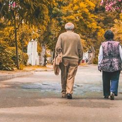 Elderly couple walking together