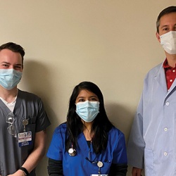 Dr. Kasper with third-year medical students Garret Waterstradt and Gabriela Gonzalez-Cantoran