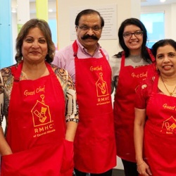 A group of people in Red aprons